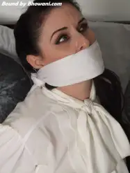 Photo of Caroline Pierce in bondage.
