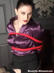 Photo of Caroline Pierce in bondage.
