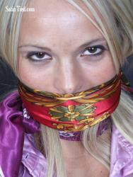 Photo of Holly McGuire in bondage.