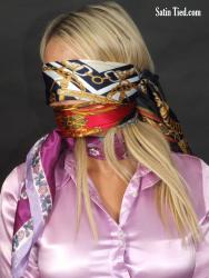 Photo of Holly McGuire in bondage.