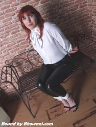 Photo of Kitty Quinzell in bondage.