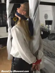 Photo of Lottie LaLay in bondage.
