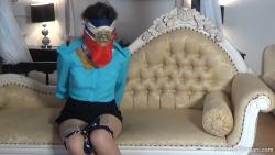 Photo of Kiki H in bondage.
